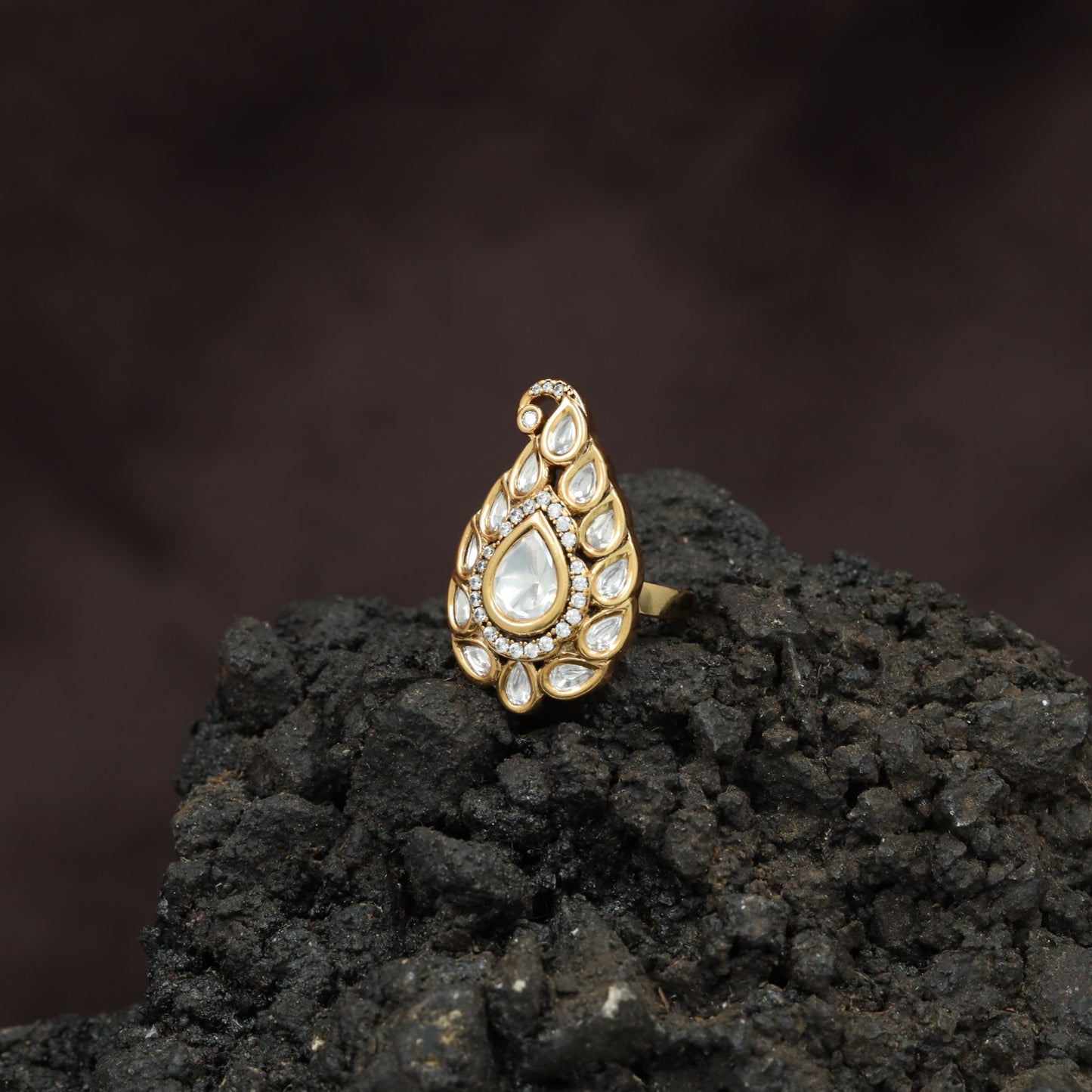 Festive Paisley Design Kundan Finger Ring With Sculpted Border Styling