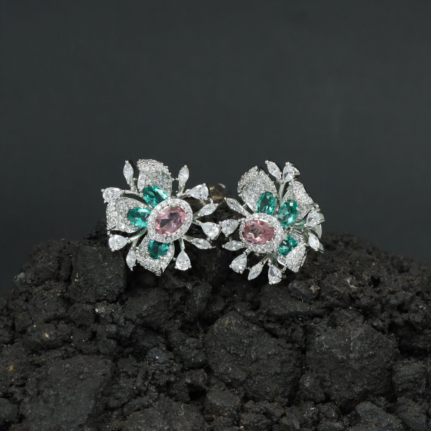 Graceful Rhodium Stud Showcasing a Floral Bloom Around an Oval Centre