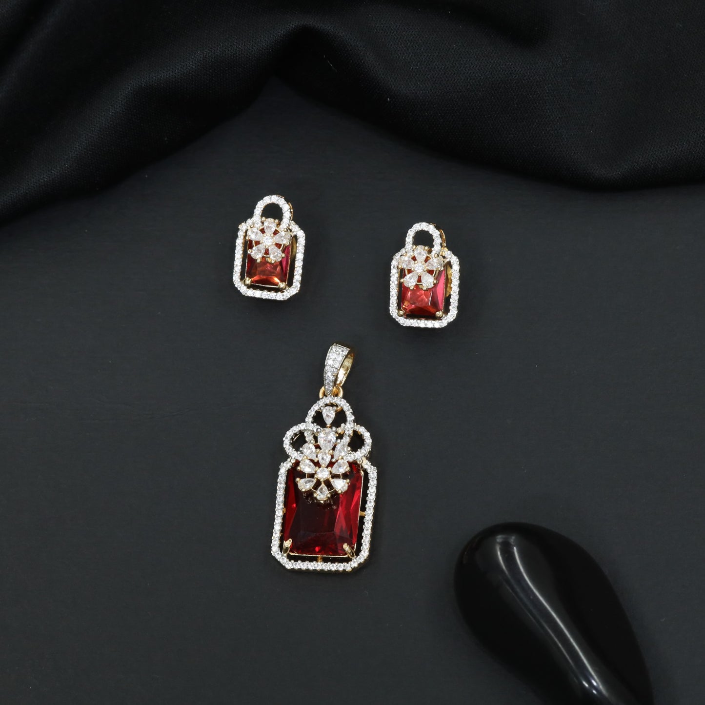 Open-frame pendant set with blossom centerpiece and matching studs