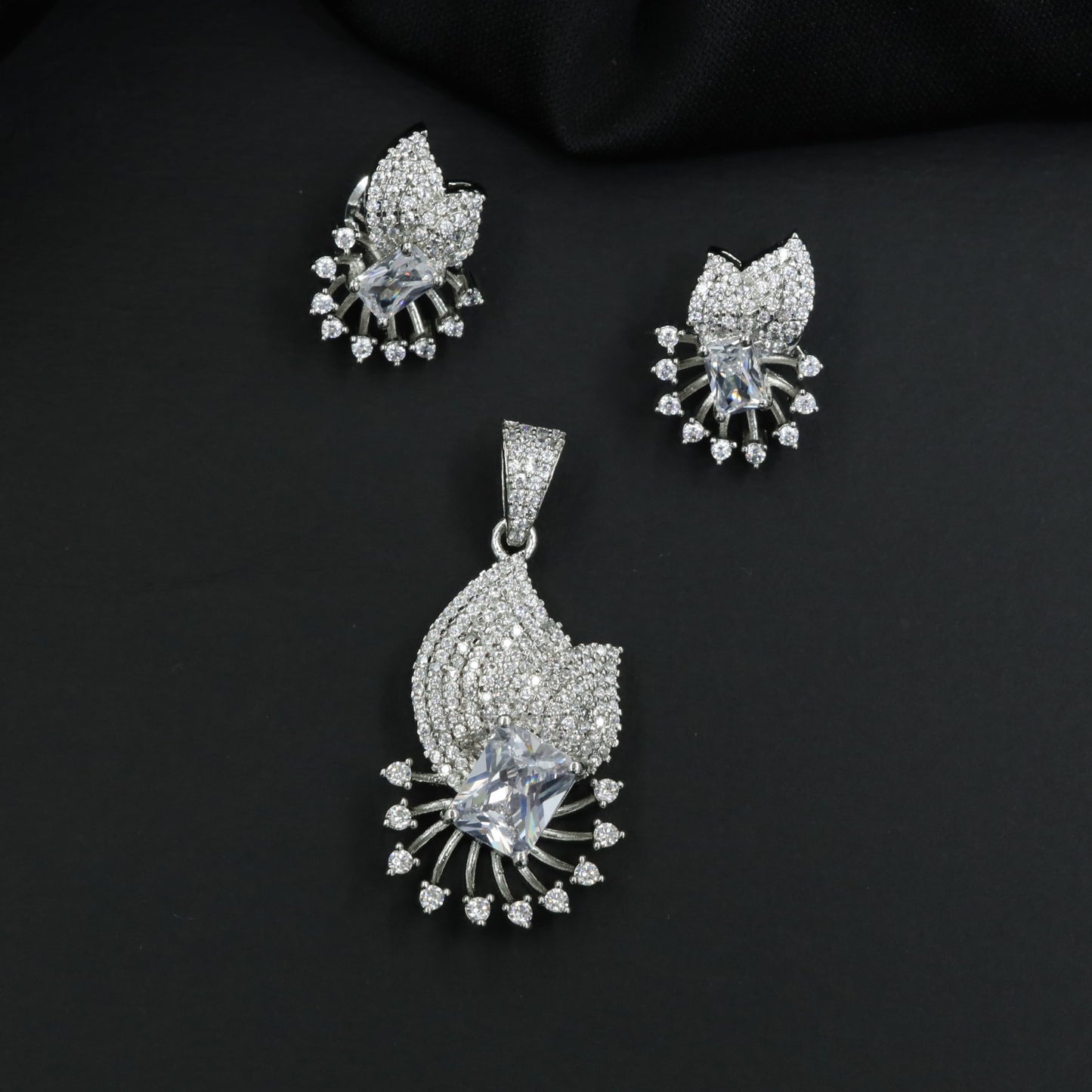 Crescent fan pendant set with geometric centerpiece detailing