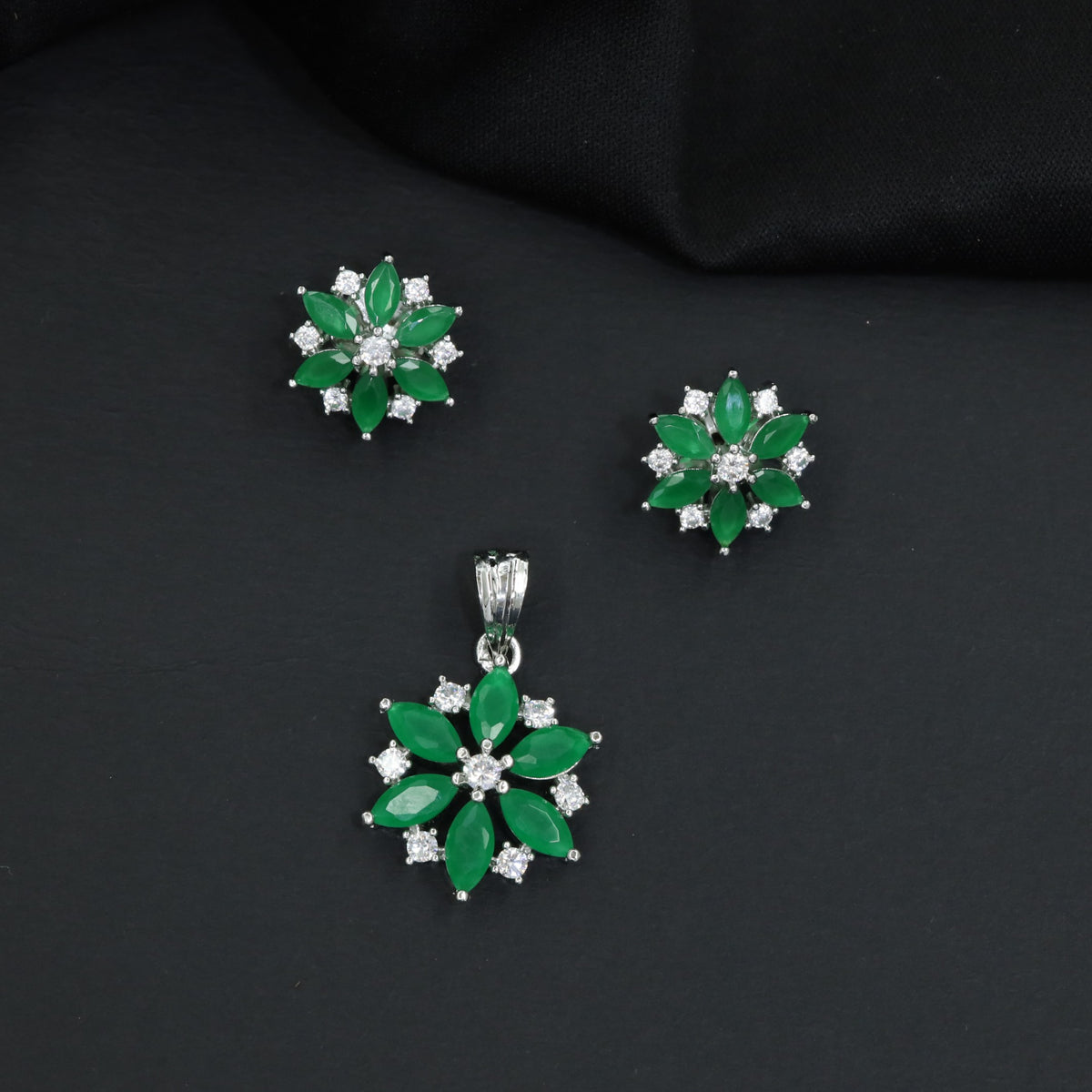 Floral bloom pendant set with marquise petal detailing and matching stud earrings