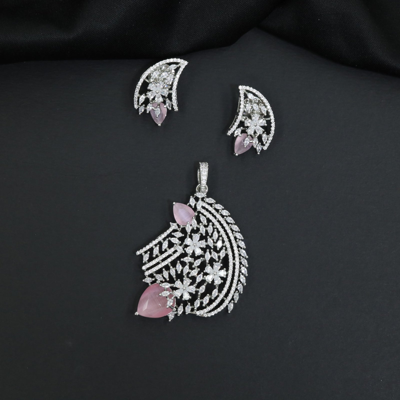 Floral bouquet pendant set with cascading leaf formations and matching earrings