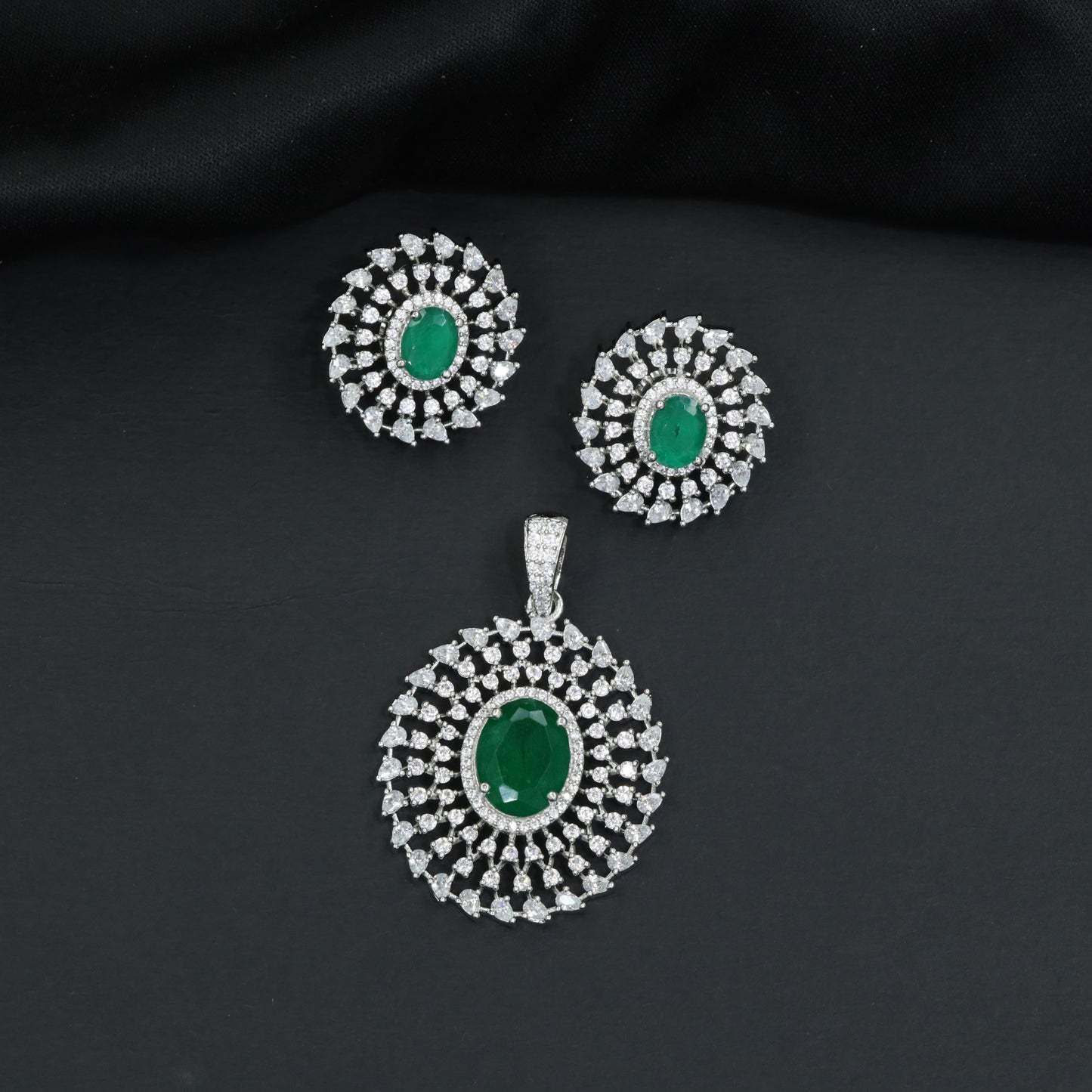Circular floral pendant set showcasing concentric petal formations and matching studs