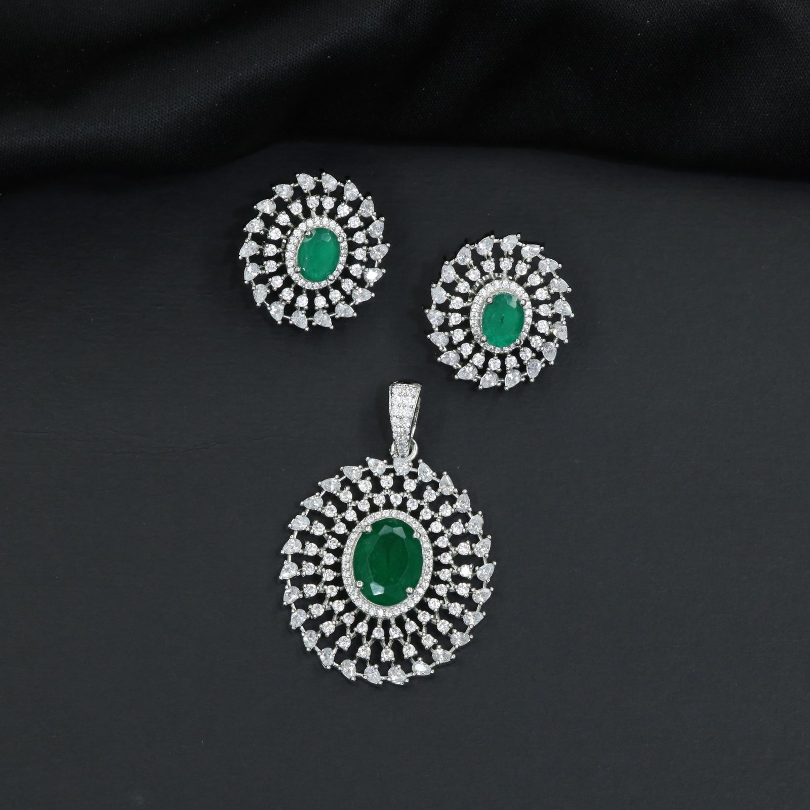 Circular floral pendant set showcasing concentric petal formations and matching studs