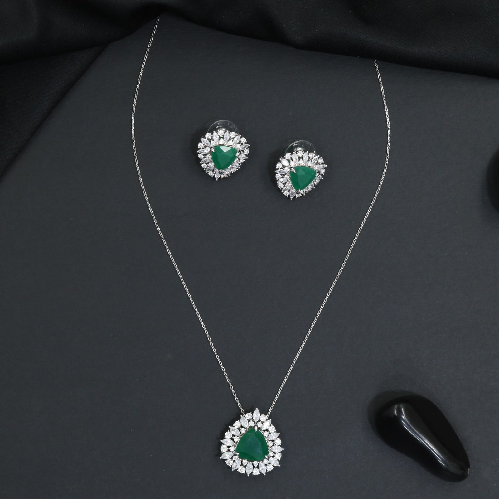 Elegant pendant chain set with a floral burst frame and teardrop focal element