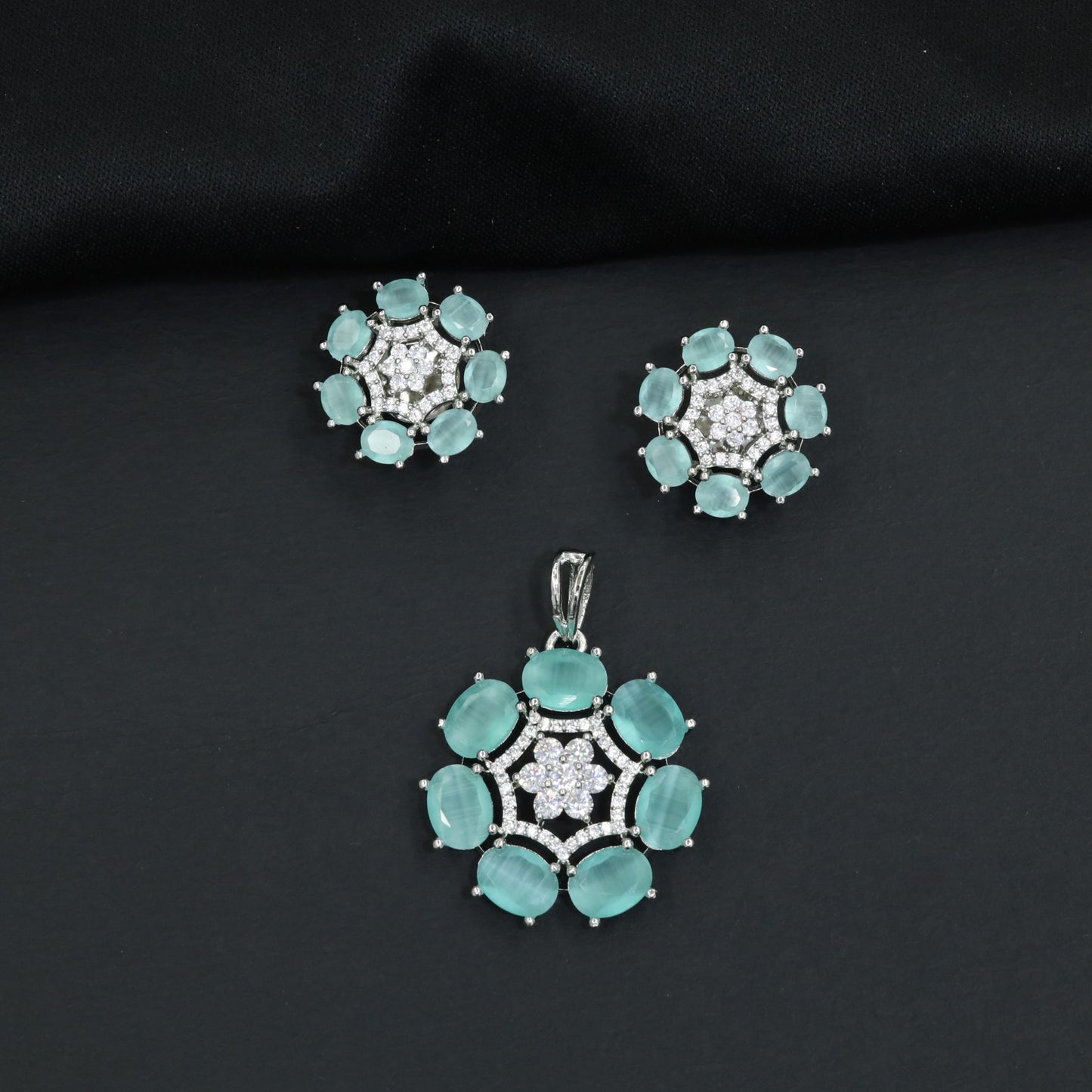 Statement floral pendant set featuring a flower bloom centerpiece and circular petal arrangement