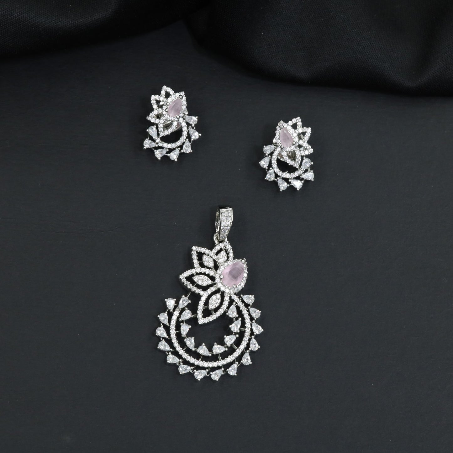 Designer pendant set showcasing a flower silhouette with cascading leaf accents
