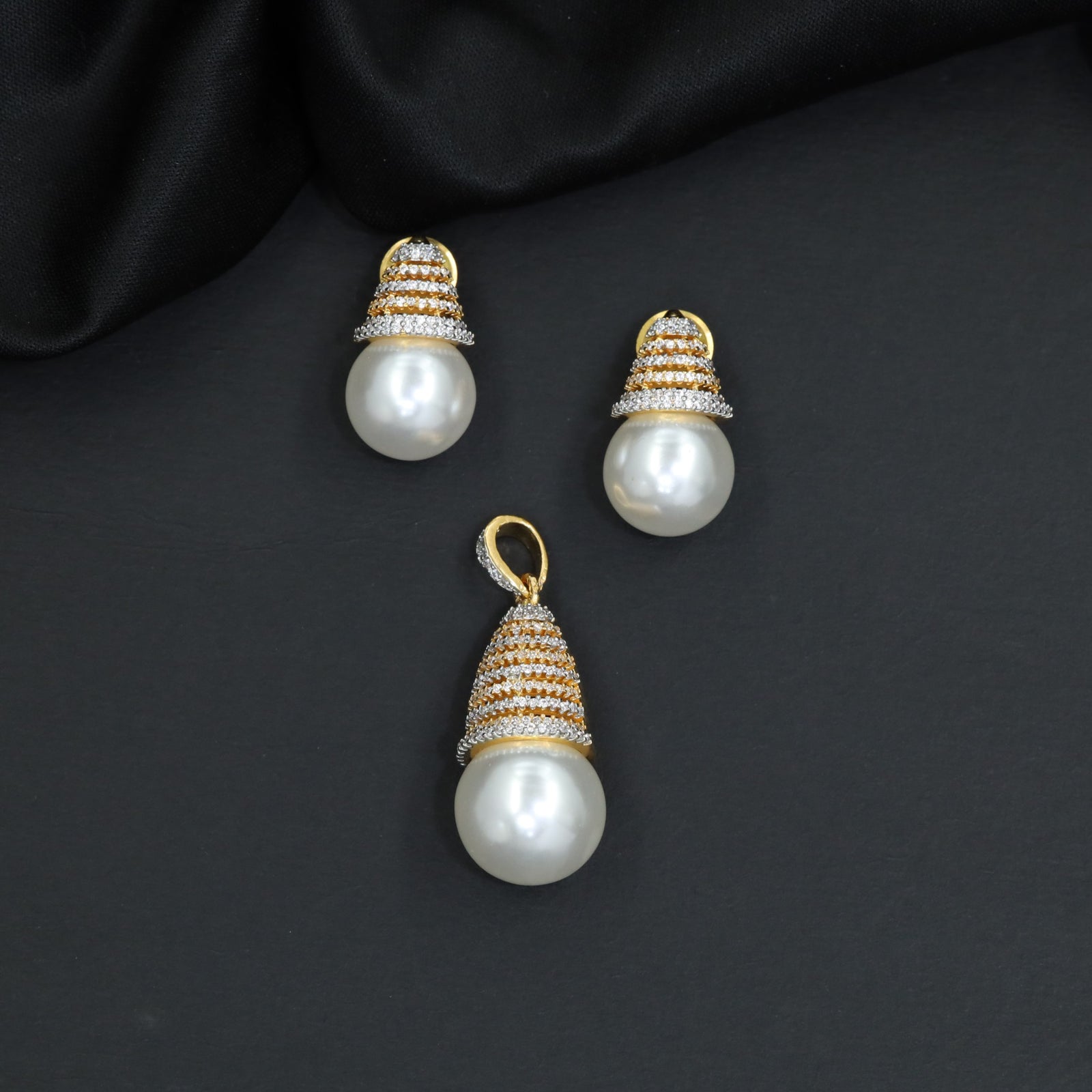 Dome cap pendant set with pearl drop centerpiece and matching stud earrings