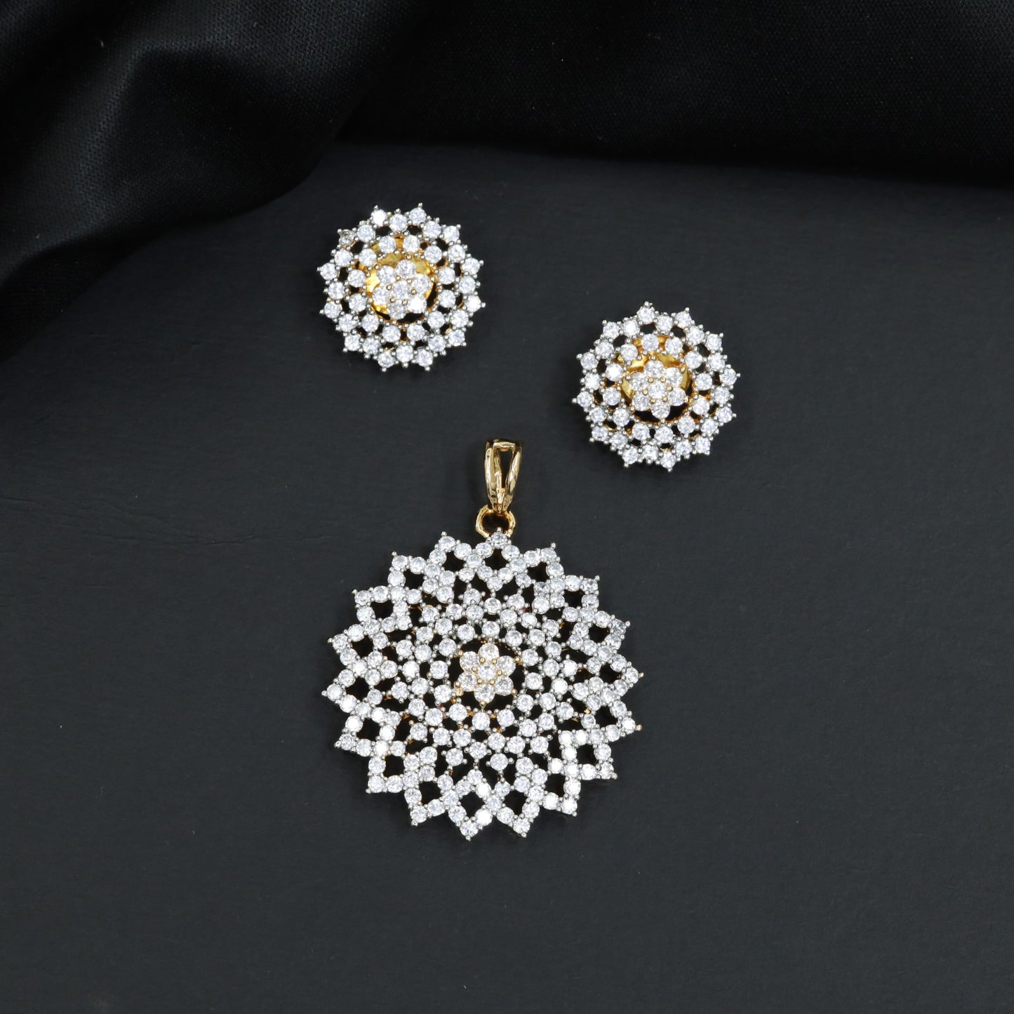 Grand pendant set framed by starburst panel borders
