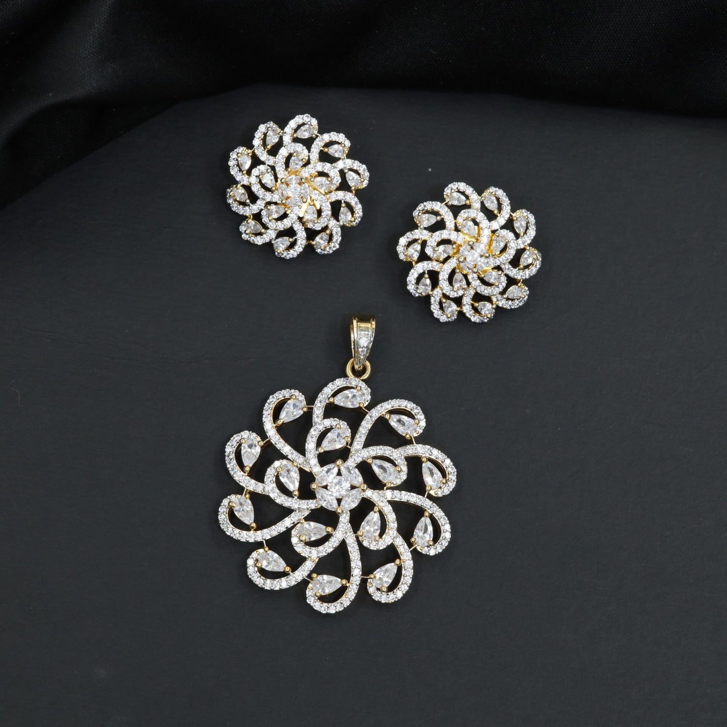 Elegant pendant set with swirling floral framework