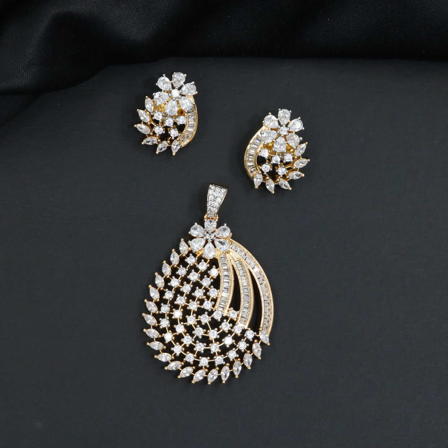 Minimalist stone cluster lattice pendant set featuring an asymmetrical floral border