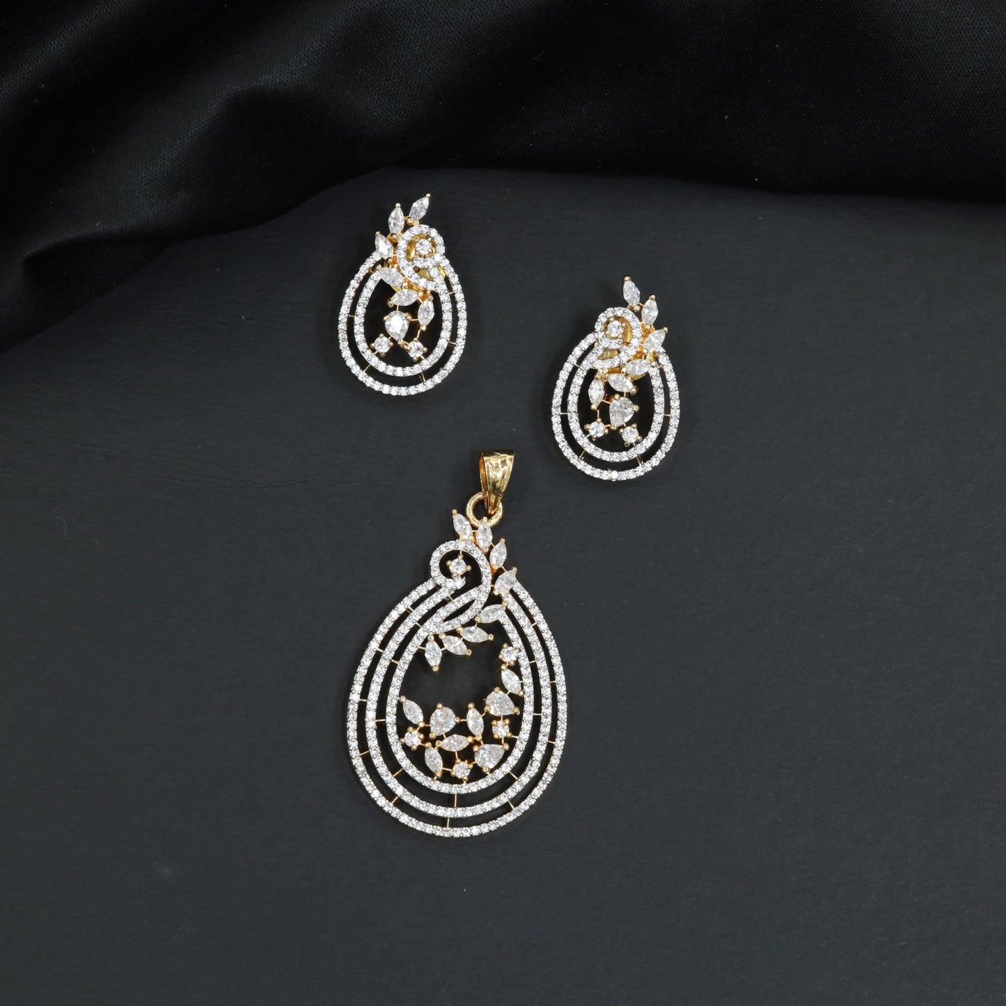 Radiant white stone tiered loop pendant set with matching small vine studs