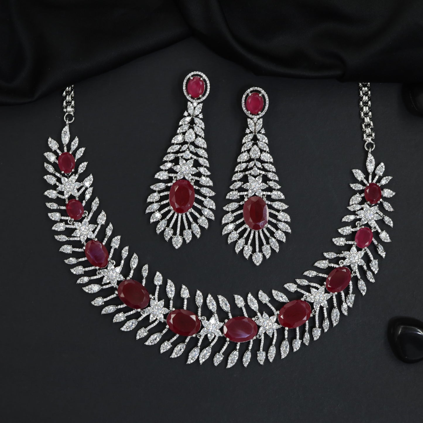 Traditional cascading marquise leaf rhodium necklace set with starburst clusters