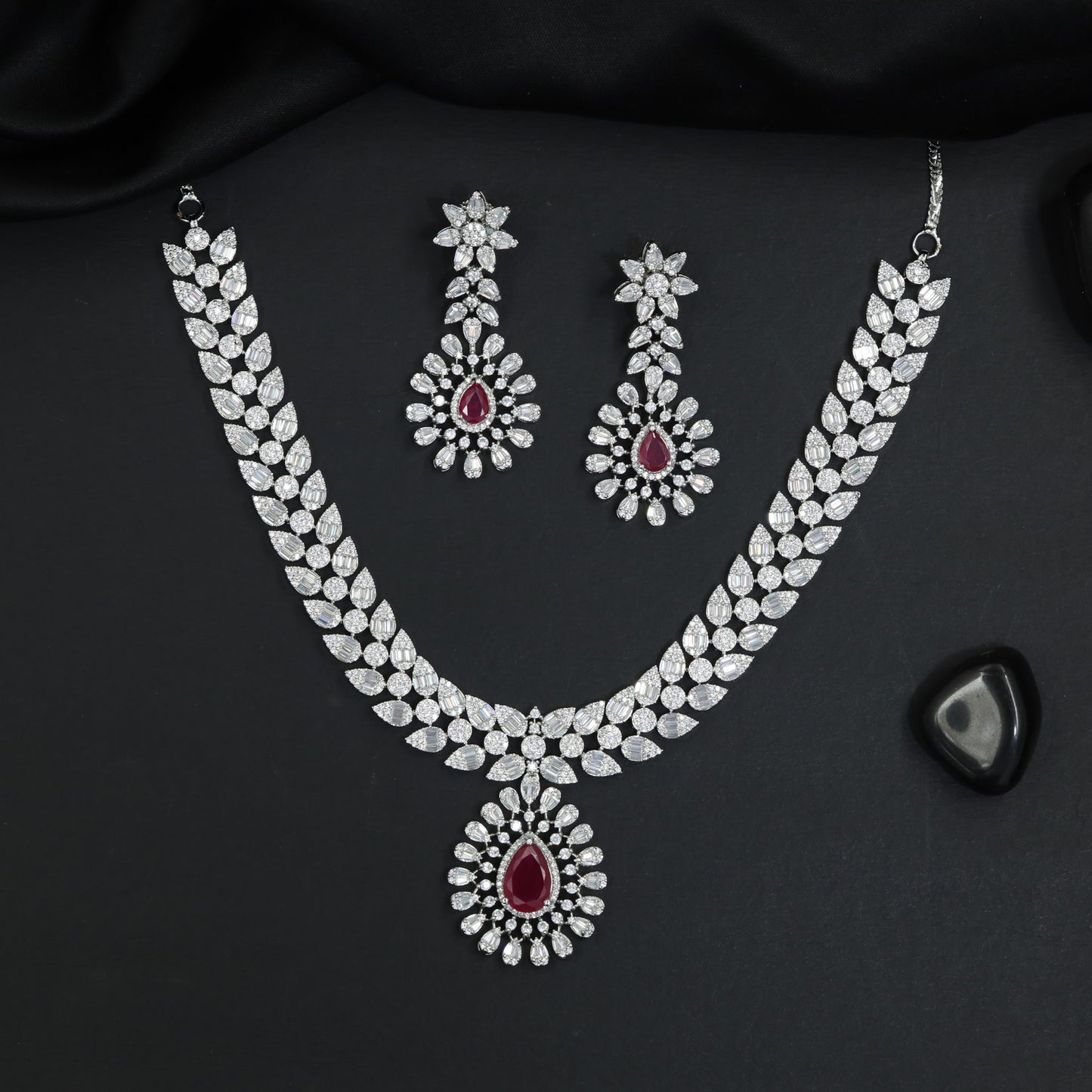 Collector's edition rhodium necklace set with radiant station detailing