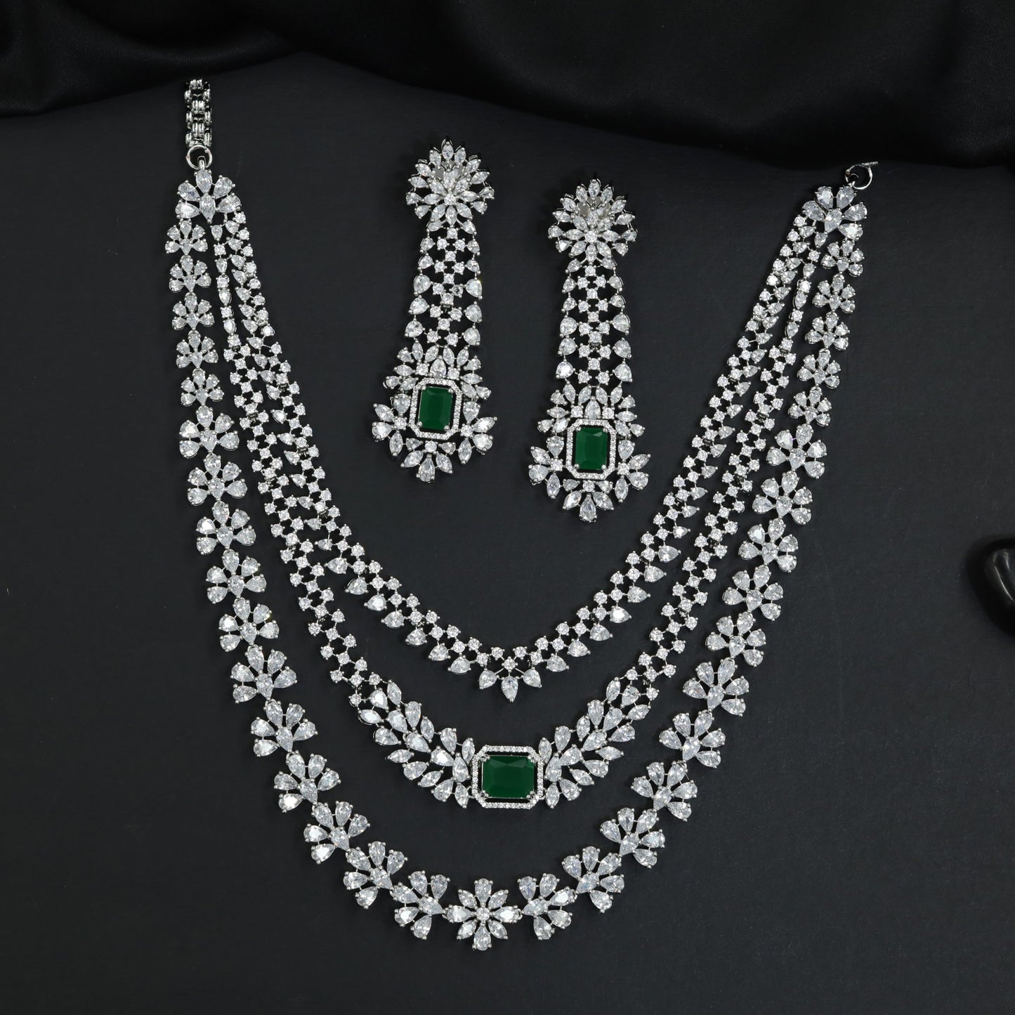 Statement silhouette rhodium necklace set with cascading strand detailing