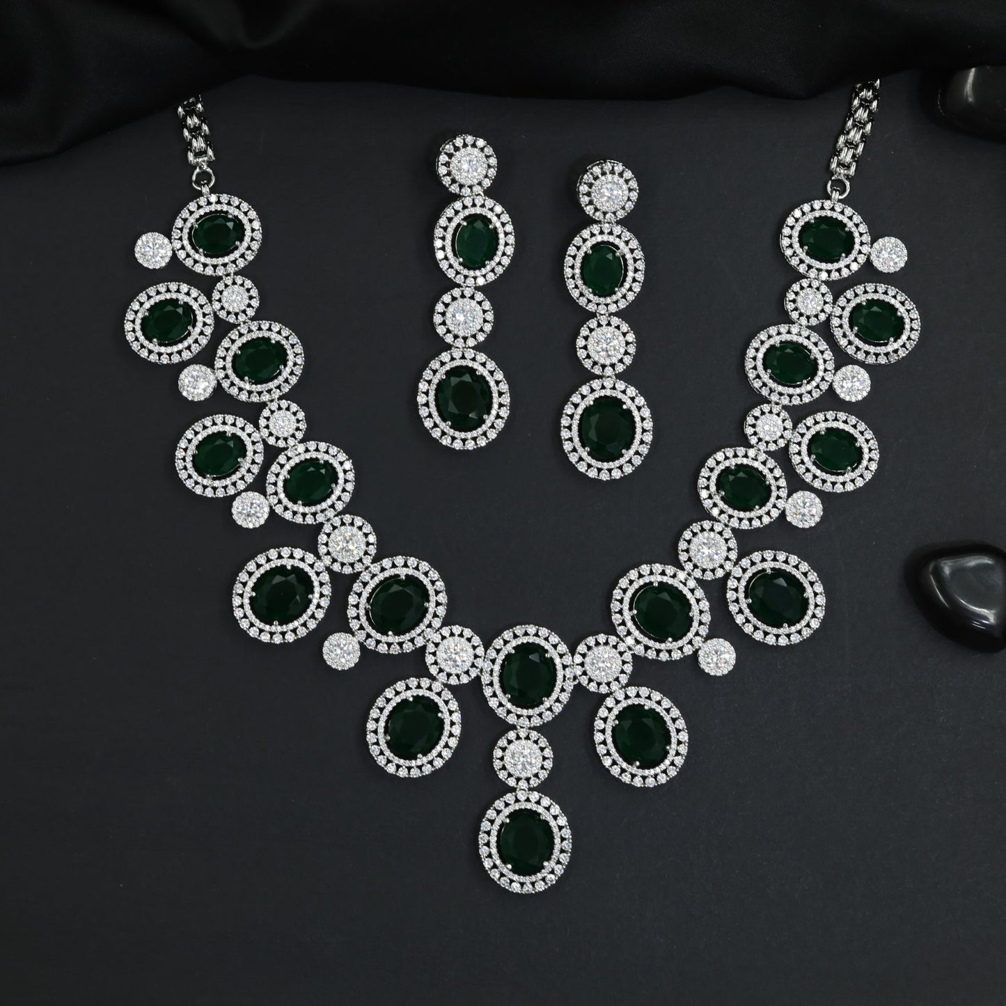 Contemporary icon rhodium necklace set with sculptural circle stations