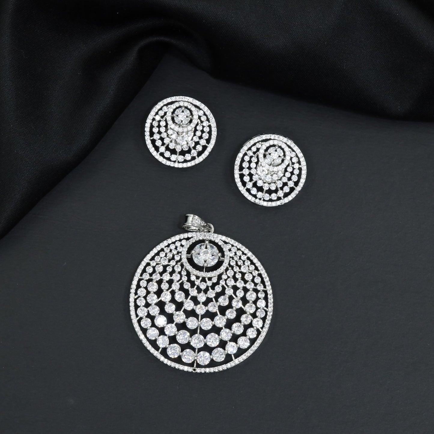 Round Pendant Set with Layered Detailing and Matching Earrings