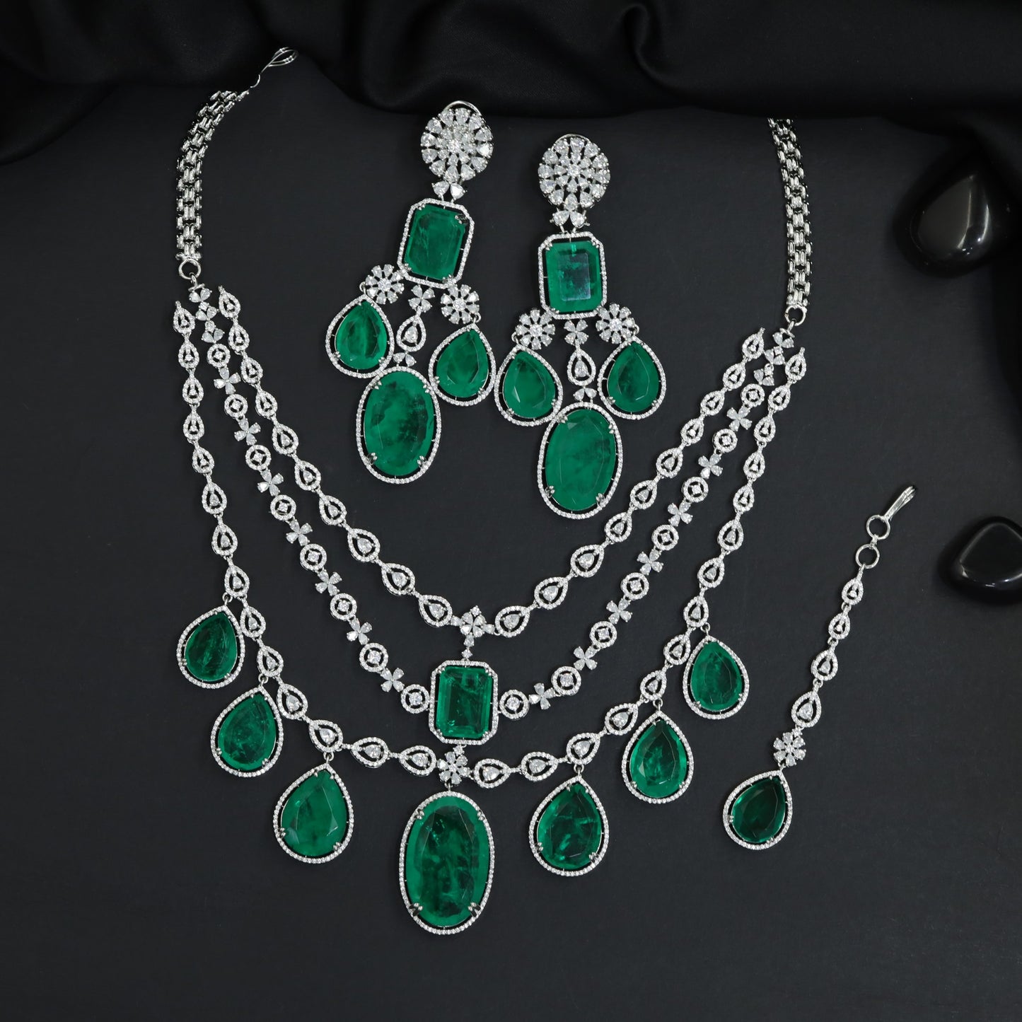 Shimmering clustered tiered statement rhodium necklace set