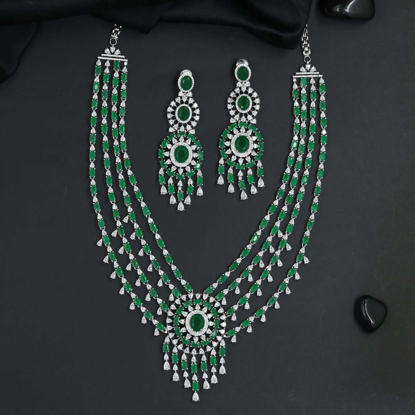 Symphonic rhodium long haara featuring cascading stone panels