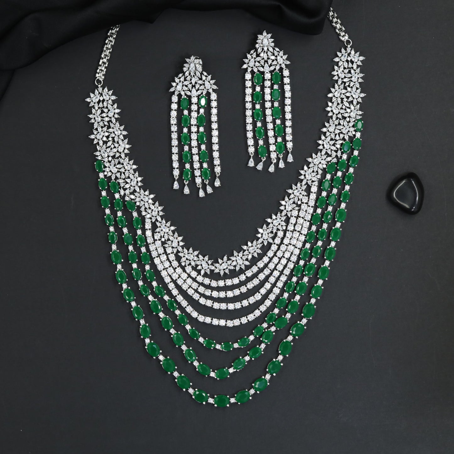 Sleek rhodium necklace showcasing structured cascade framework