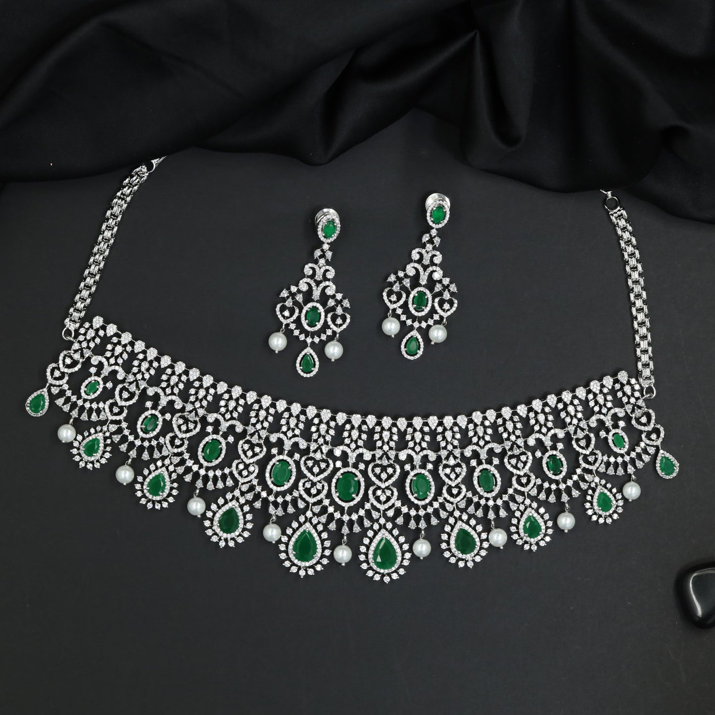 Bold rhodium choker featuring statement gemstone silhouette