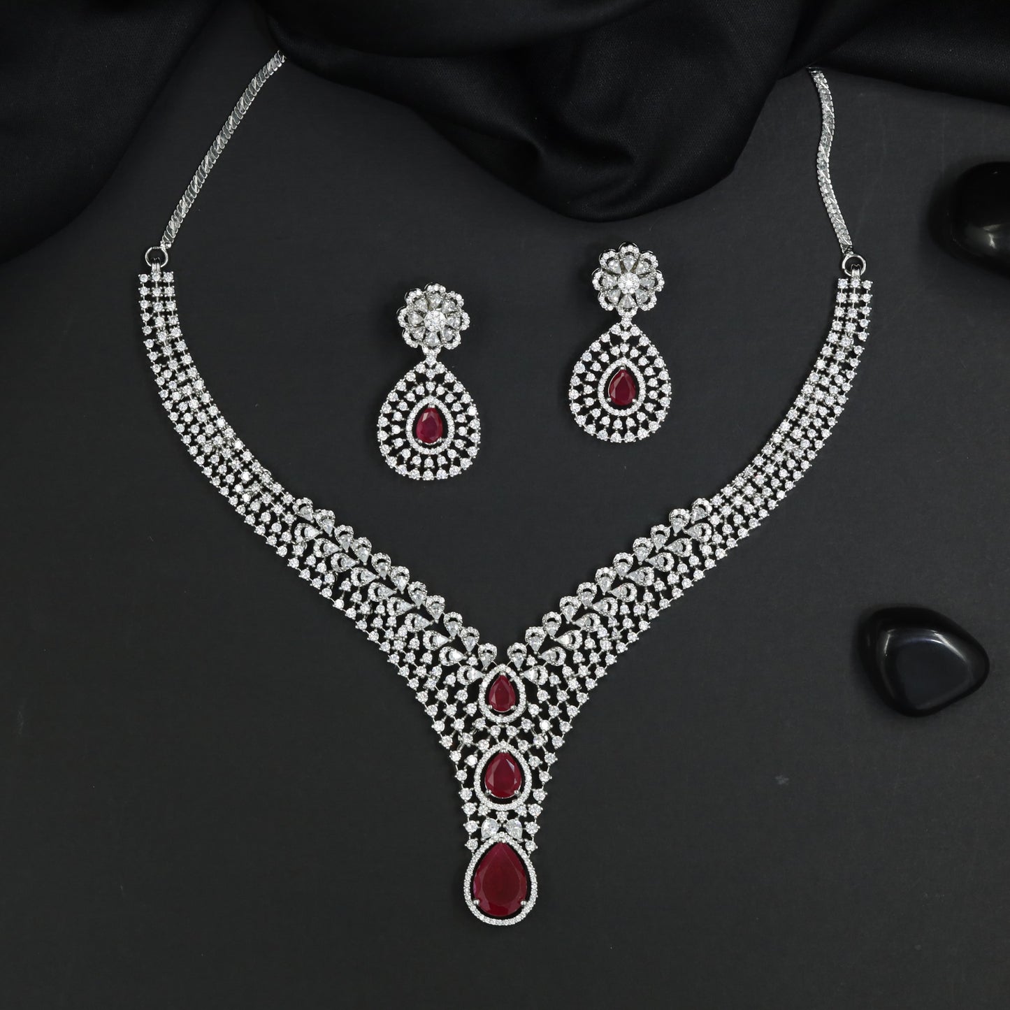 Signature rhodium necklace featuring couture symmetrical artistry