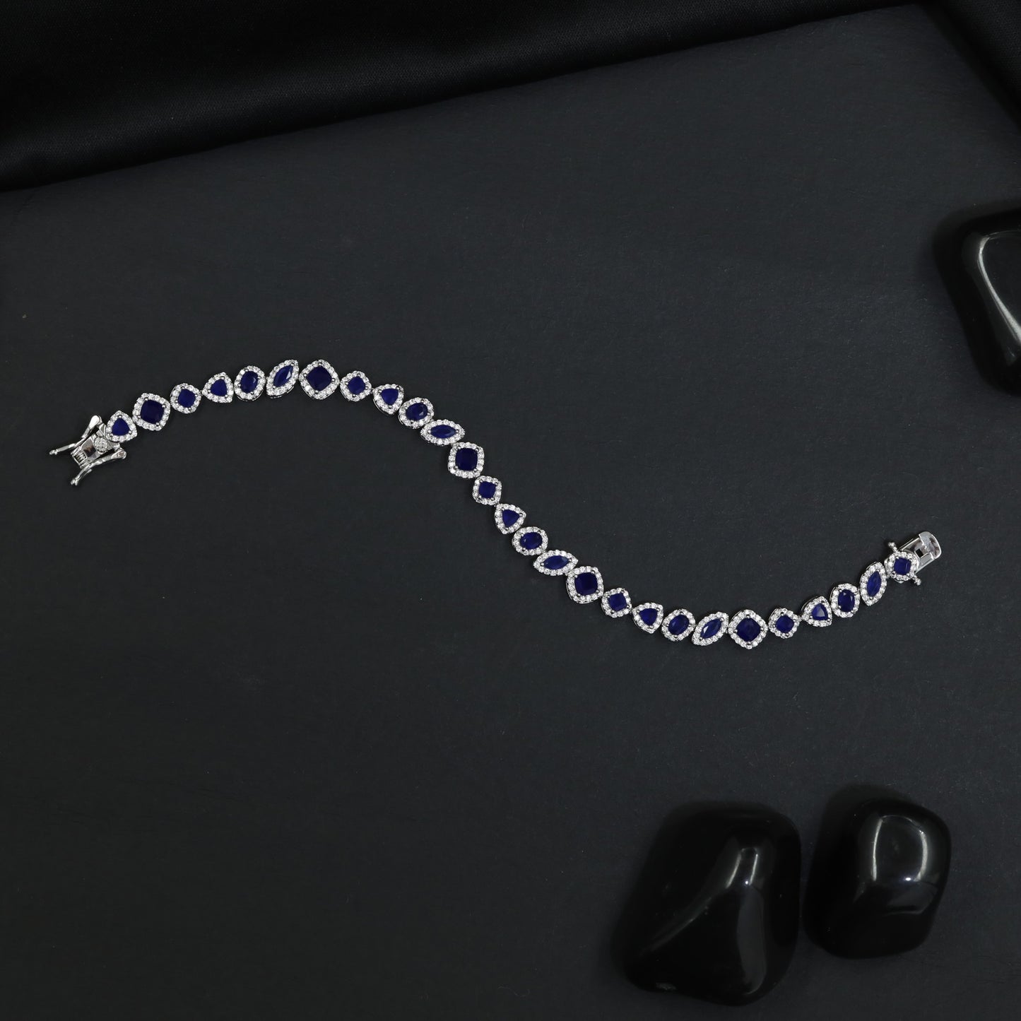 Contemporary Rhodium Bracelet with Alternating Floral and Leaf Design
