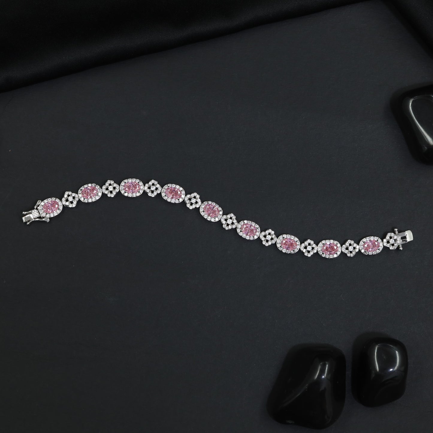 Rhodium Bracelet with Repeating Rosette Elements and Circular Links