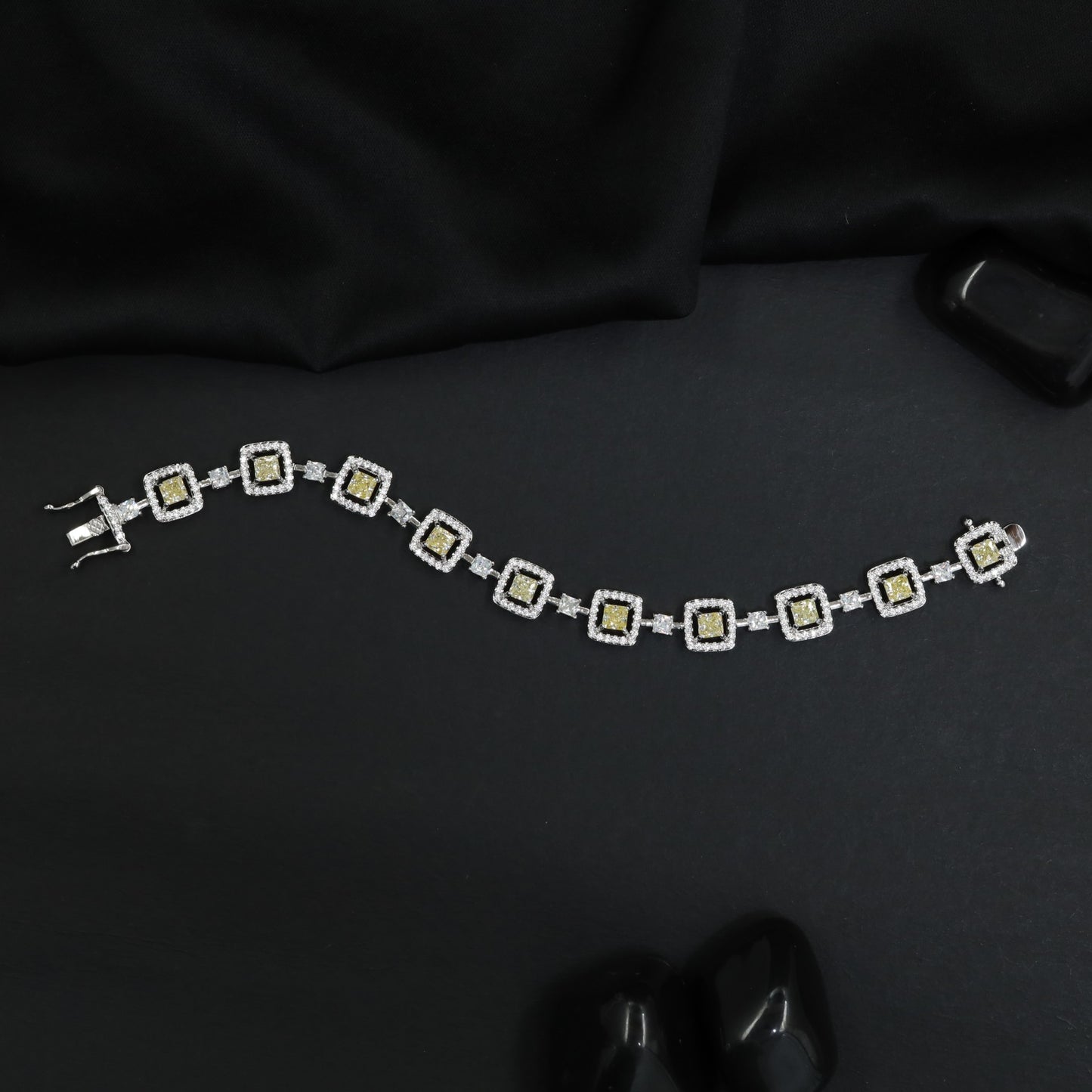 Artisan rhodium bracelet showcasing alternating square links