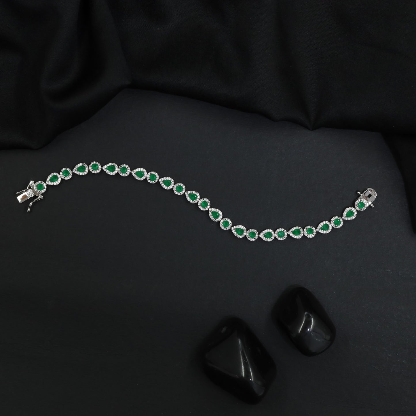 Rhodium Bracelet Featuring Alternating Leaf Elements and Round Links