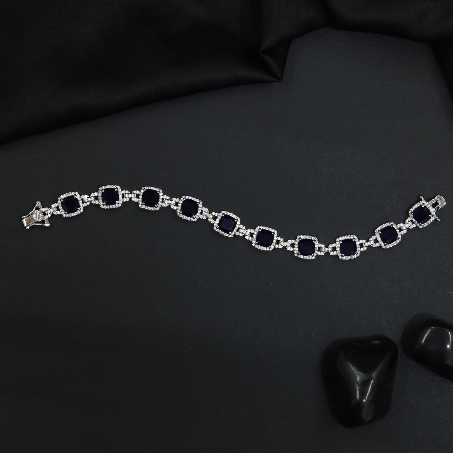 Rhodium Statement Bracelet Featuring Cushion Design and Linked Details