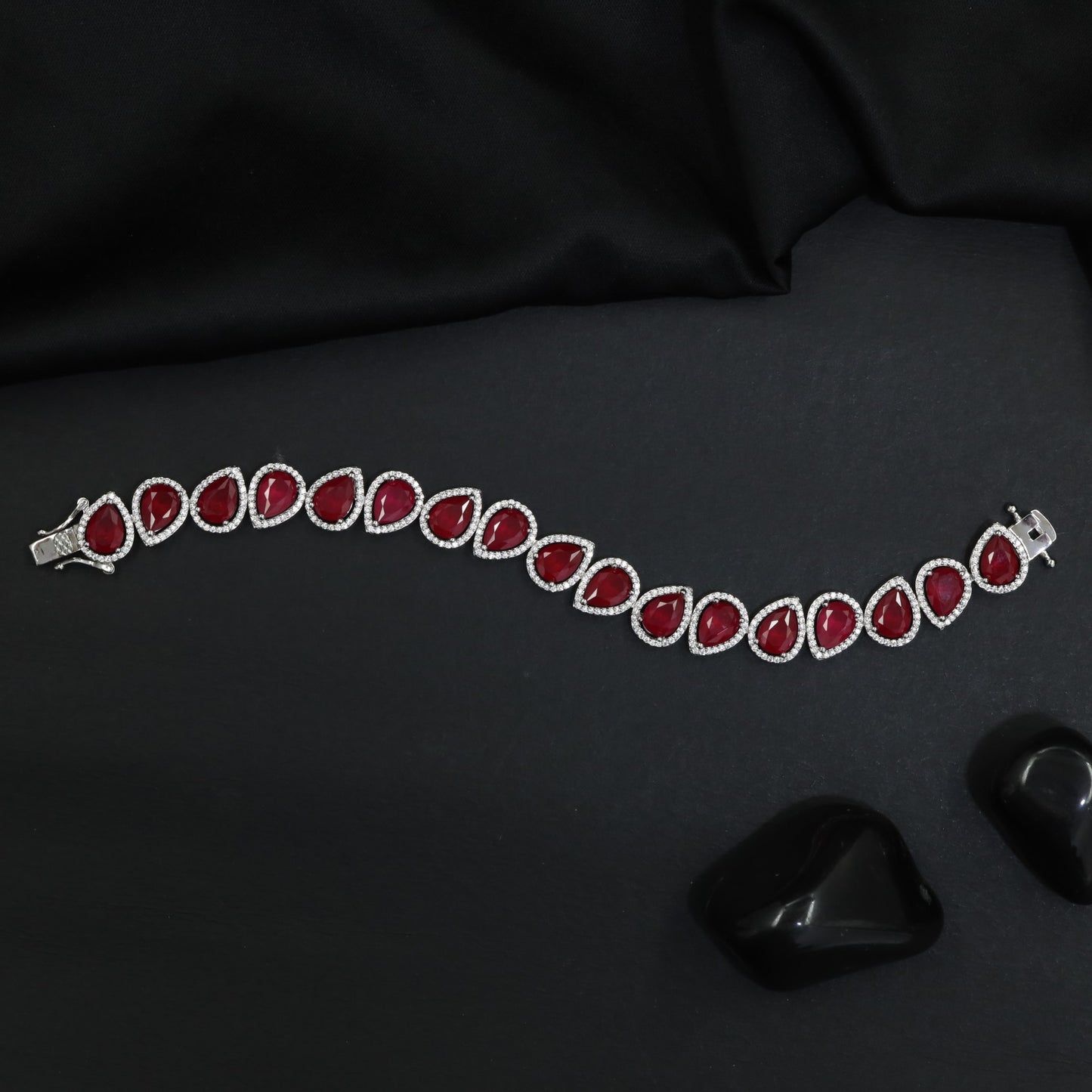 Rhodium Bracelet Featuring Oval Halo Stations and Teardrop Motifs