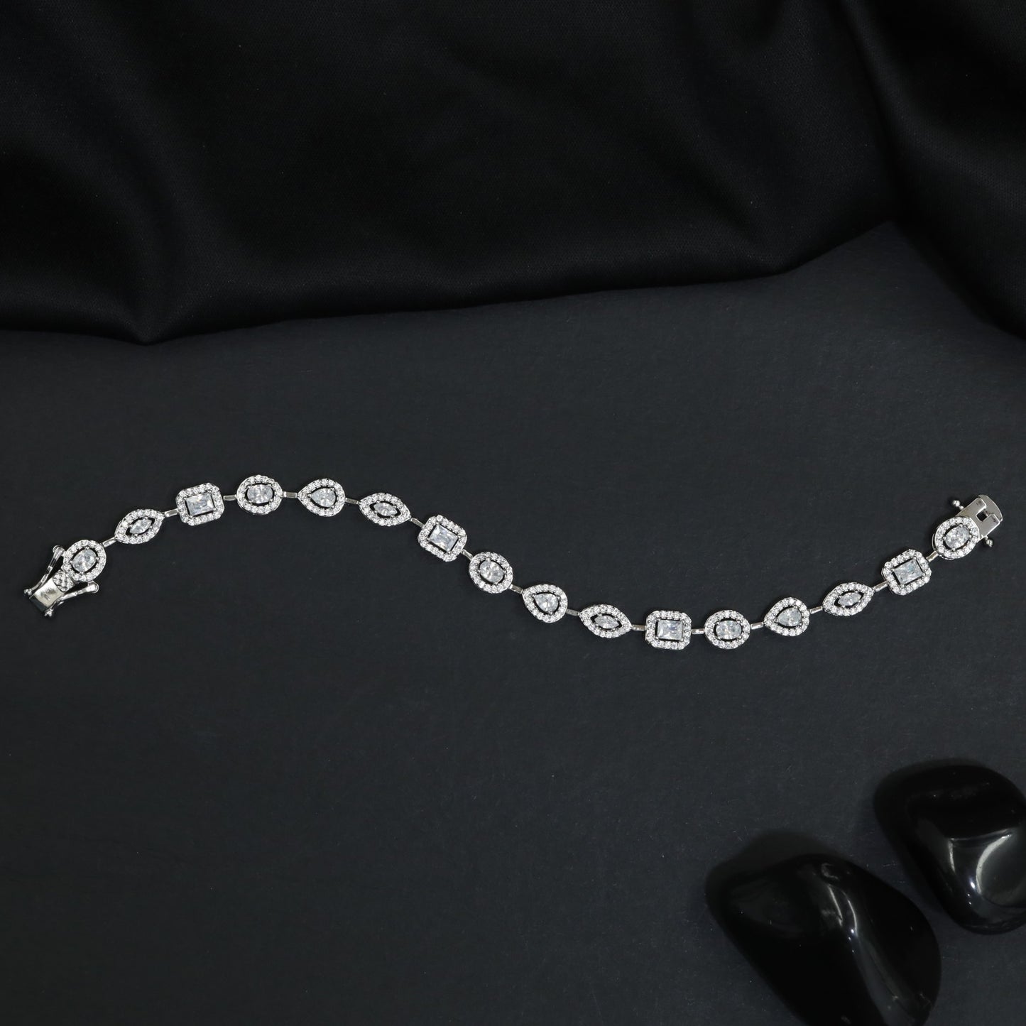 Multi Shape Halo Rhodium Bracelet with Refined Link Composition
