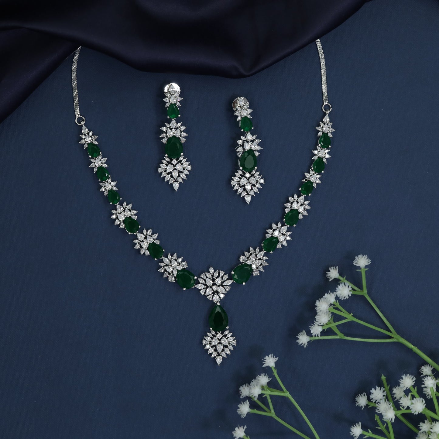 Classic rhodium necklace adorned with intricate floral patterns