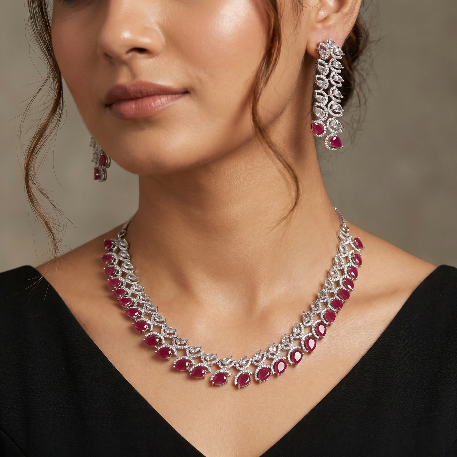 Rhodium necklace with scalloped station arrangement and fringe border