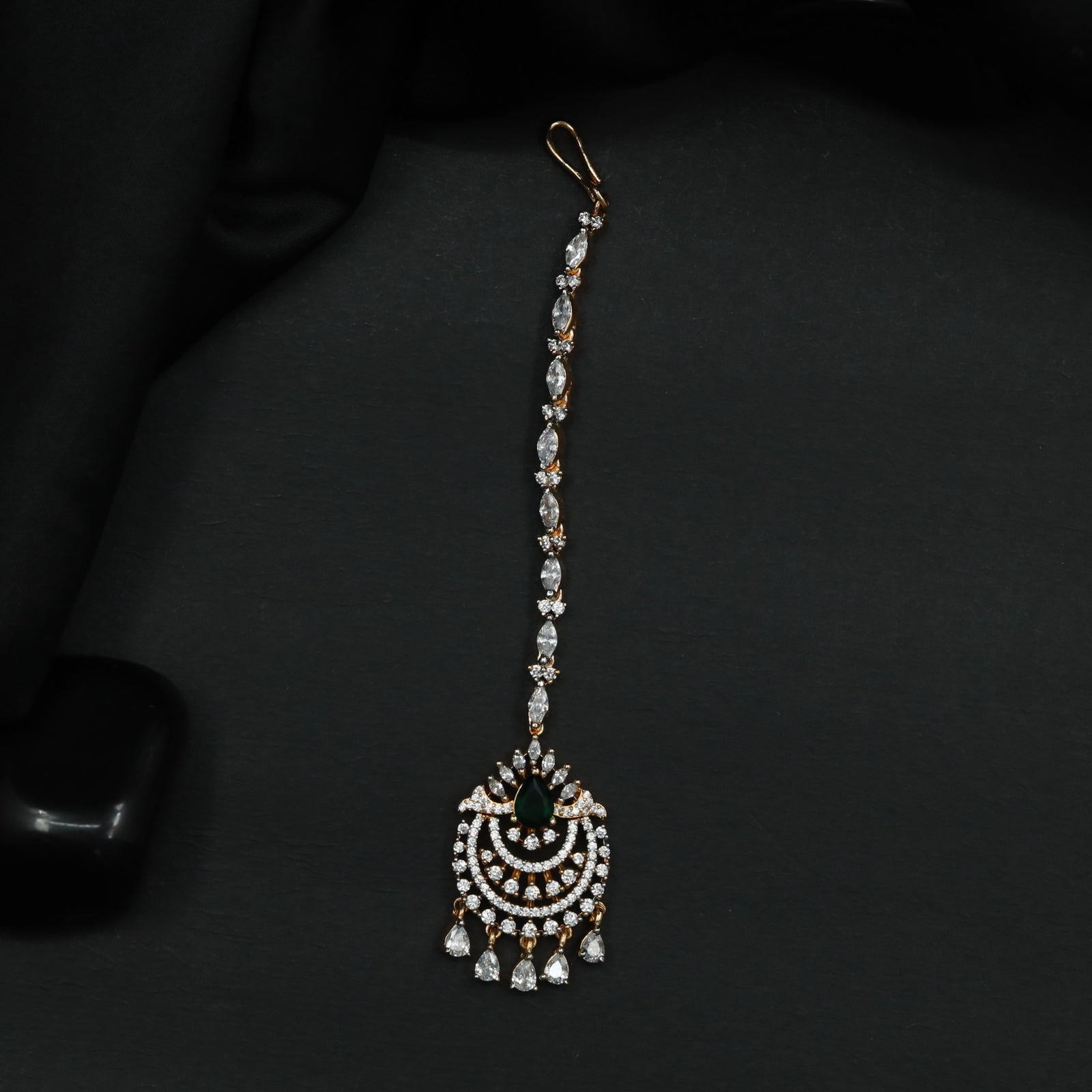 Tikka Featuring Decorative Crescent Pattern and Fringe Elements