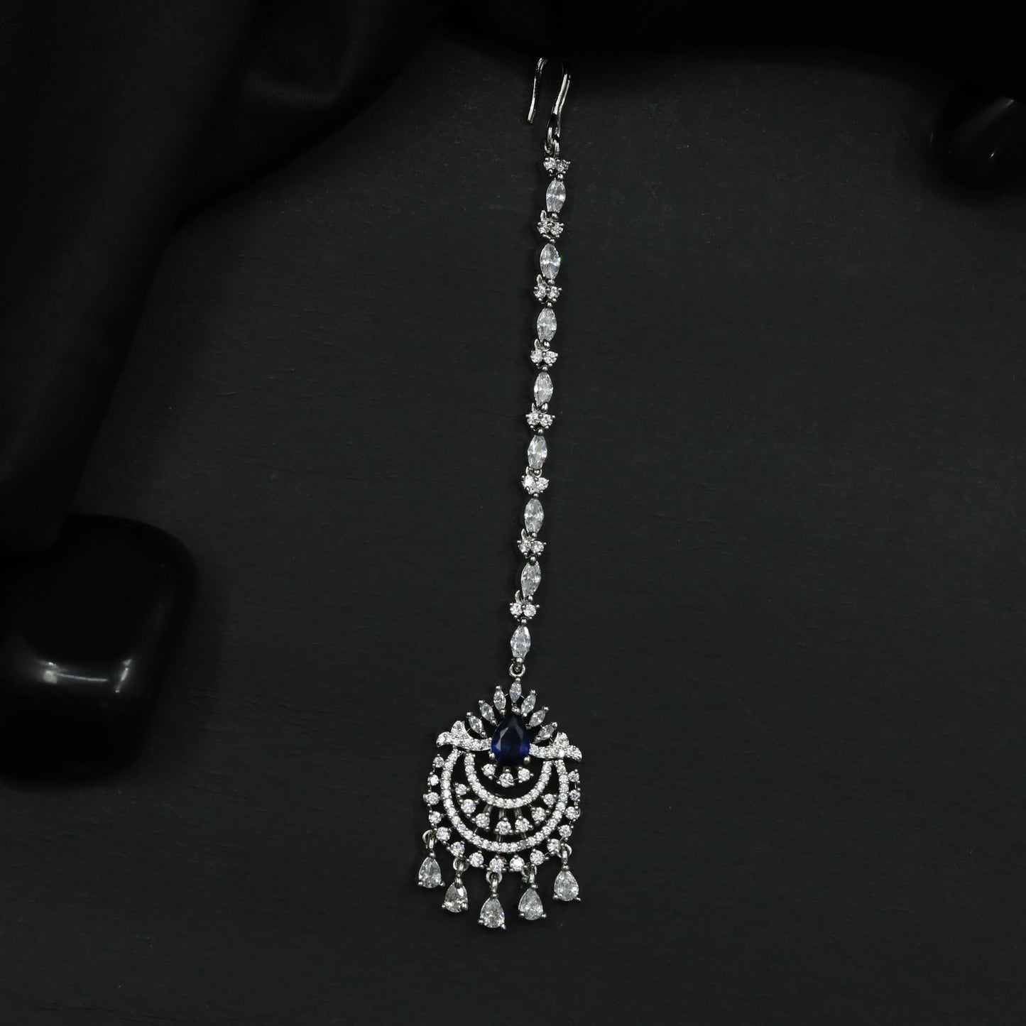 Tikka Featuring Decorative Crescent Pattern and Fringe Elements
