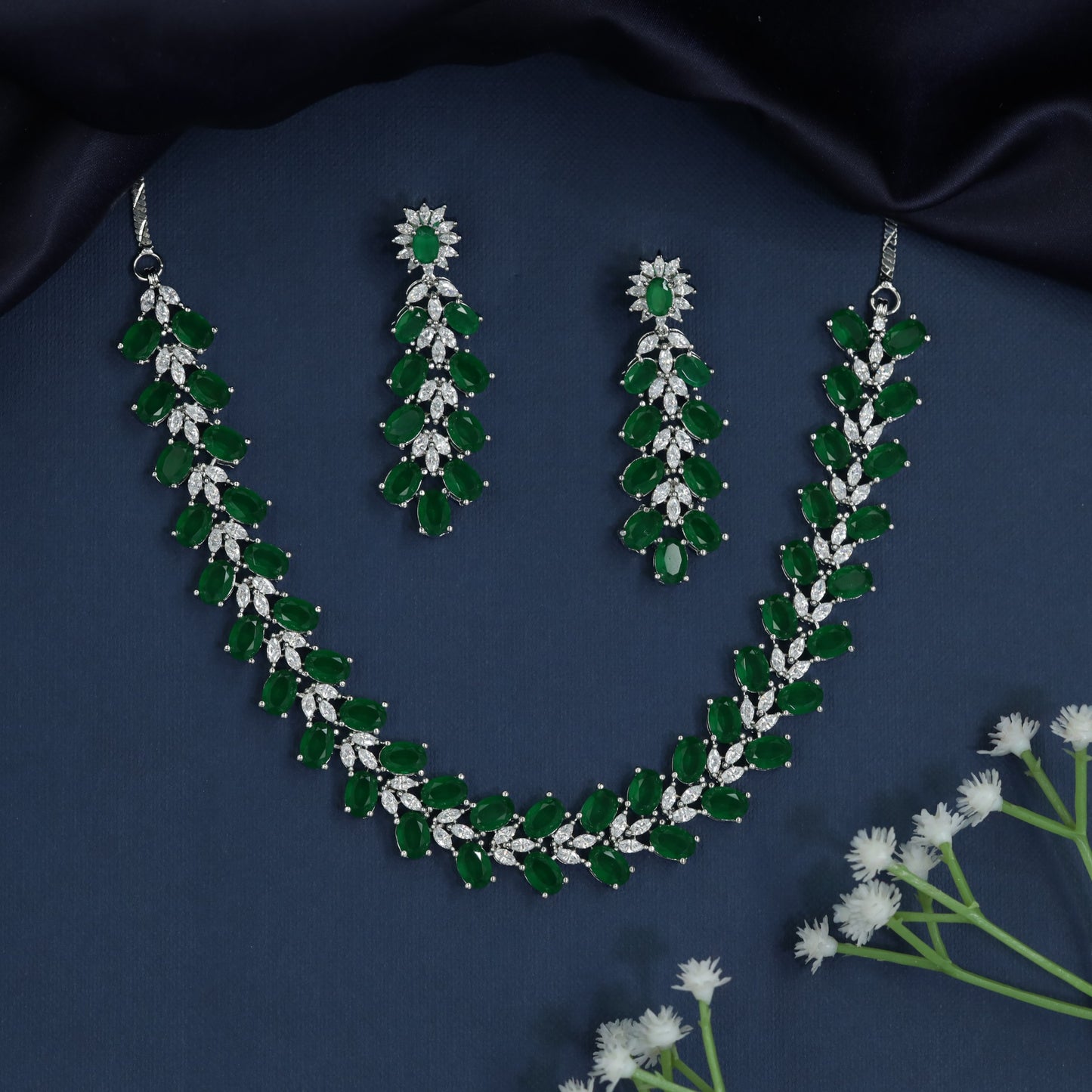 Designer necklace with sculpted gemstone arrangement