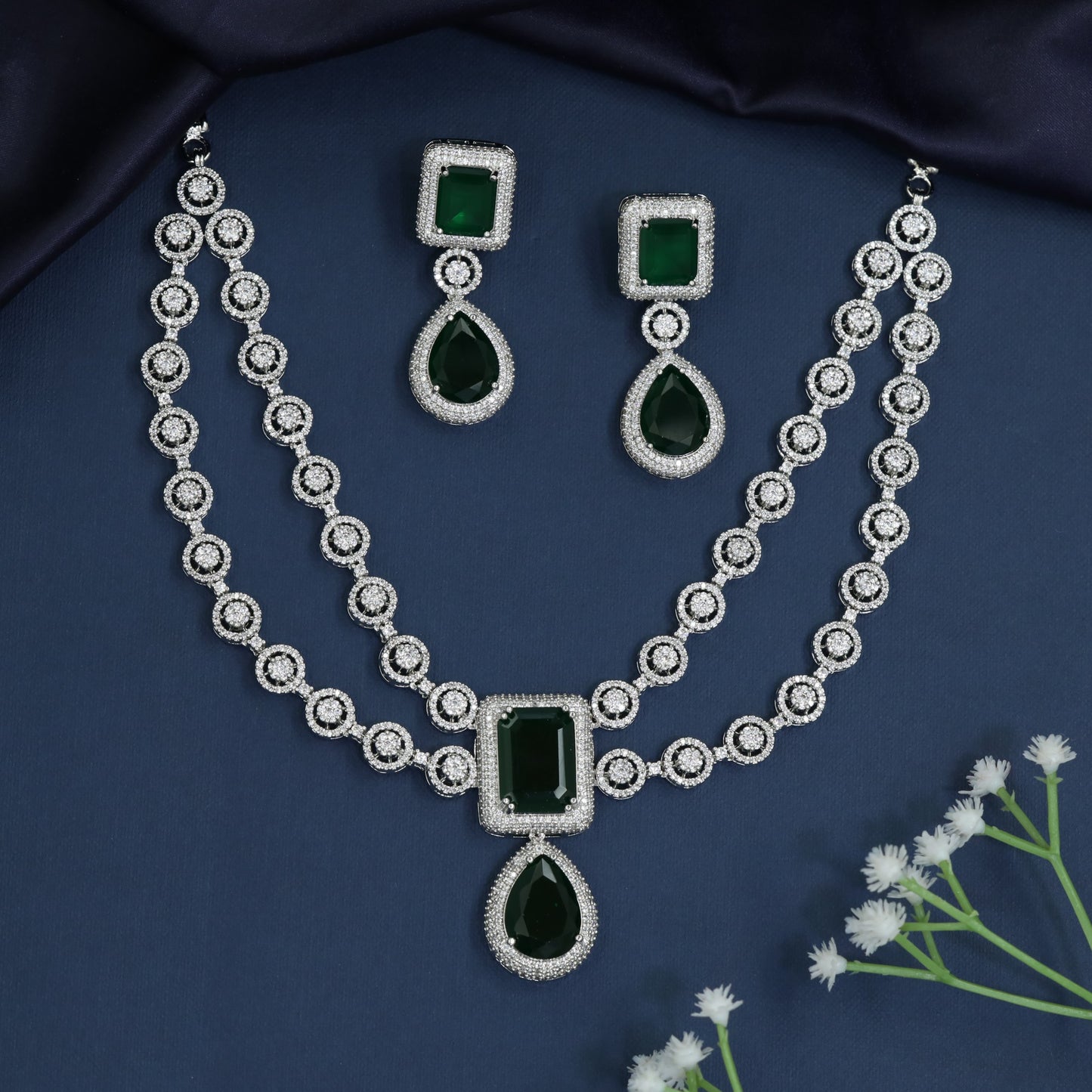 Circular frame necklace with pendant drop centerpiece