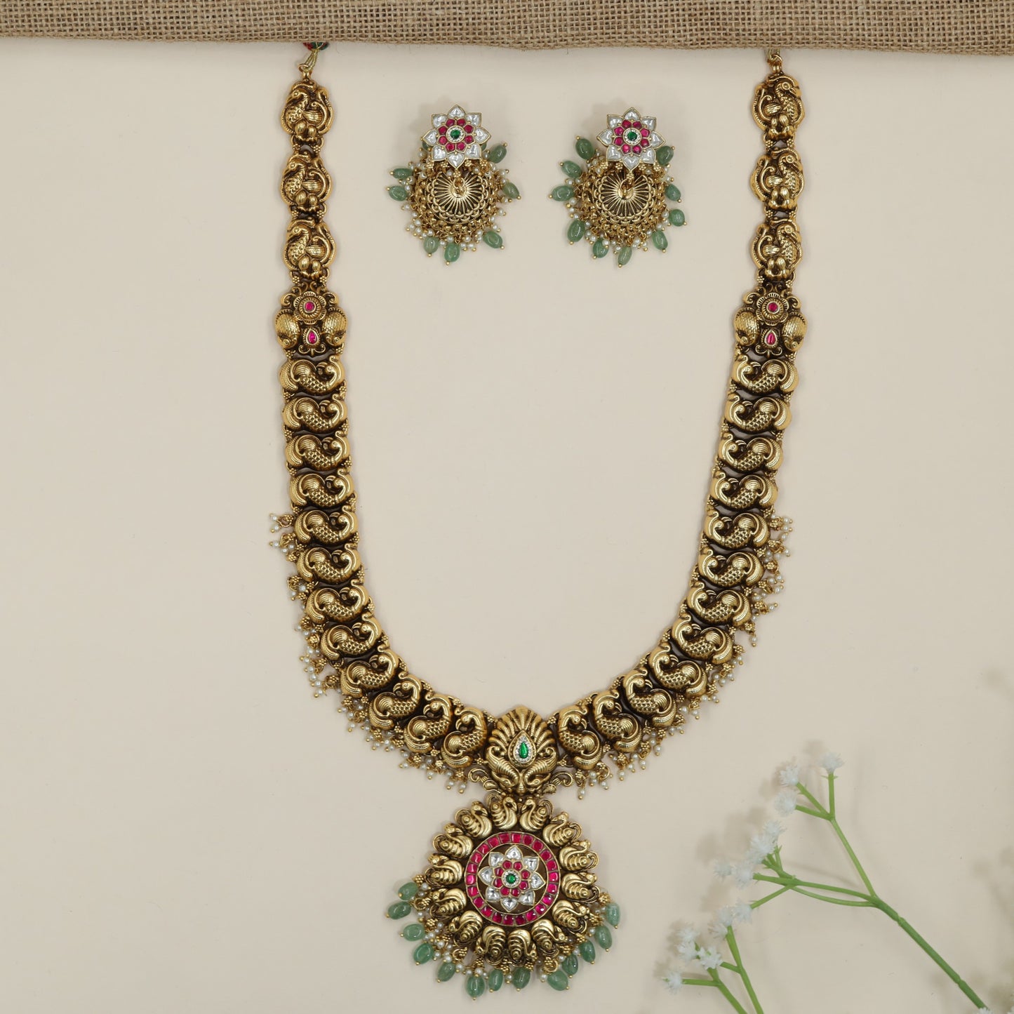 Festive peacock pendant long haara with intricate border detailing
