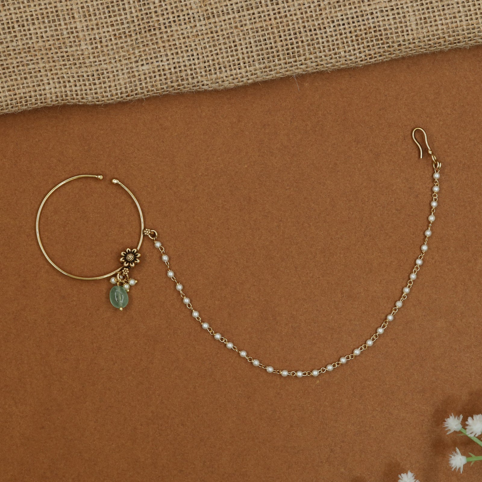 Minimalist Antique Nath with decorative floral centrepiece