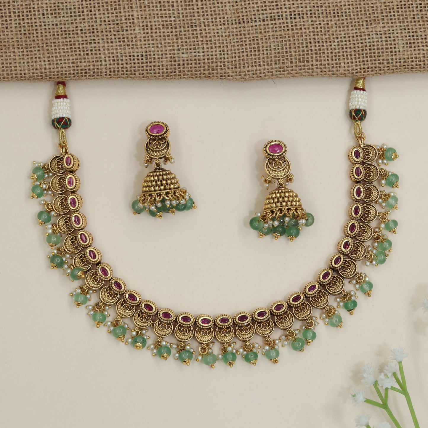 Heirloom crescent pattern necklace with cascading decorative drops