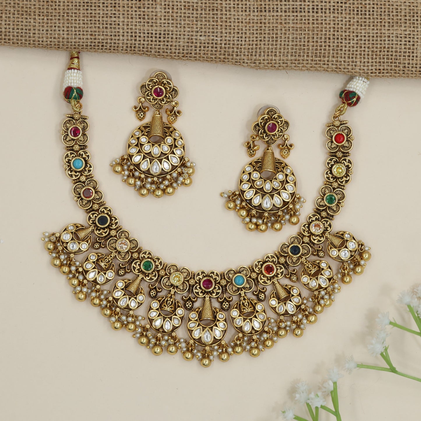 Temple-inspired floral necklace with cascading chandbali accents