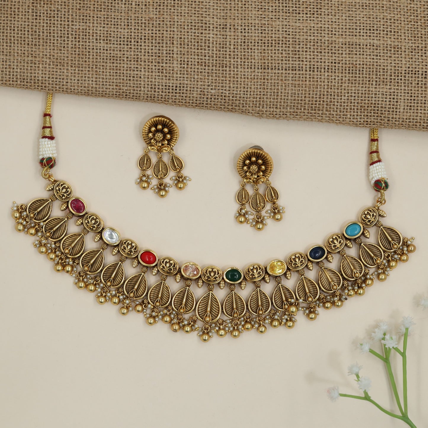 Traditional leaf pattern choker with layered botanical silhouette