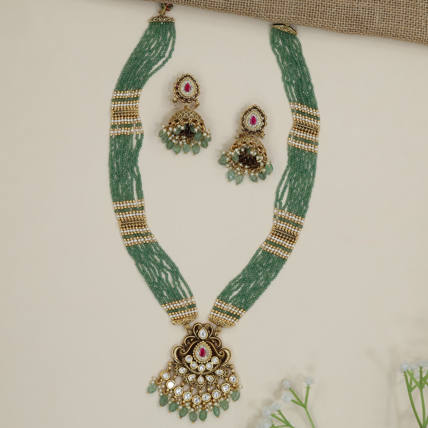 Antique pendant beads long haara with multi-strand silhouette and ornamental centrepiece