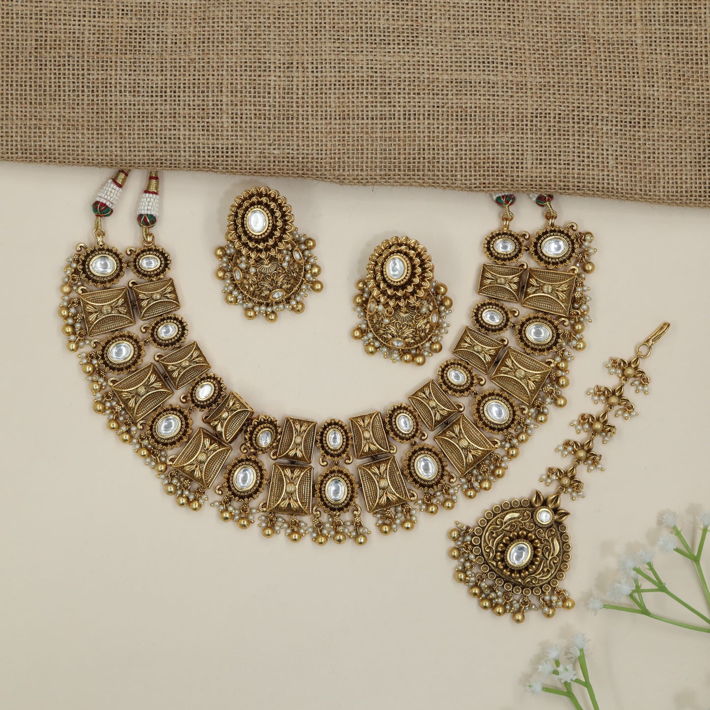 Heritage ornamental choker with engraved motifs and decorative fringe