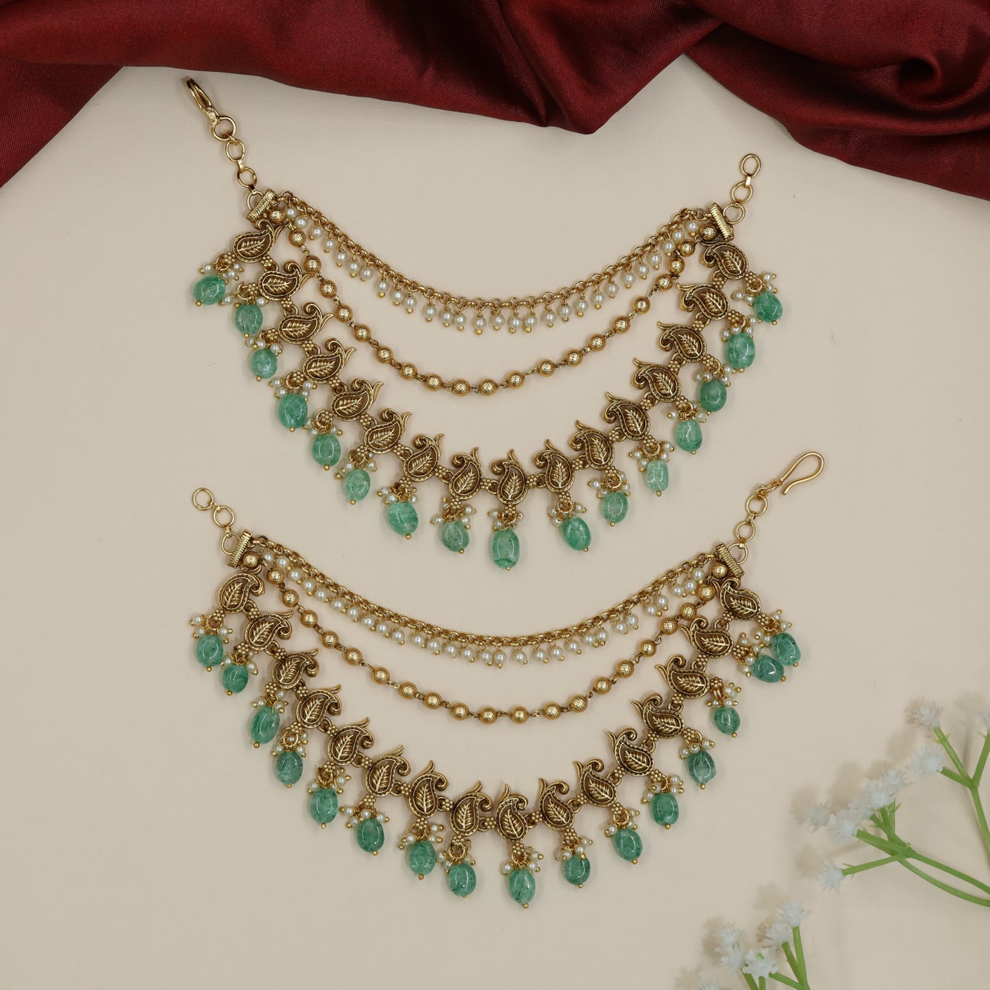 Sculpted peacock Antique Mati with decorative fringe silhouette