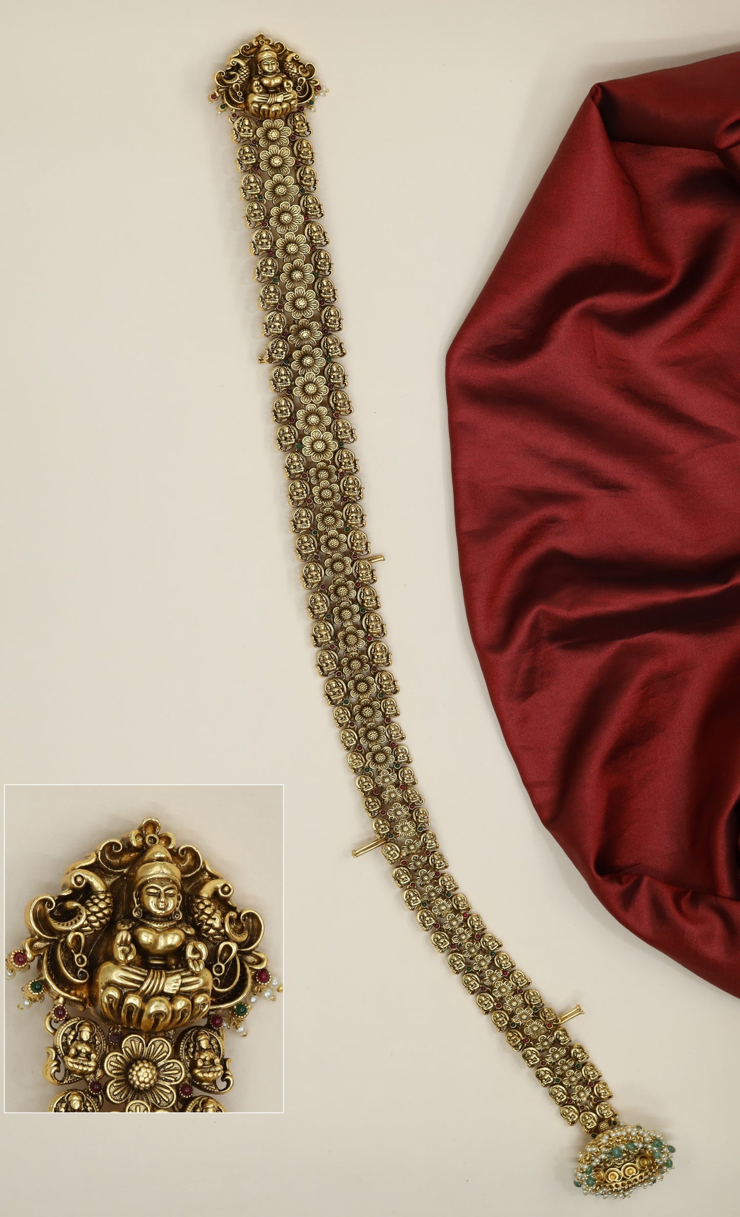 Antique temple long jade featuring Lakshmi motif and floral connectors