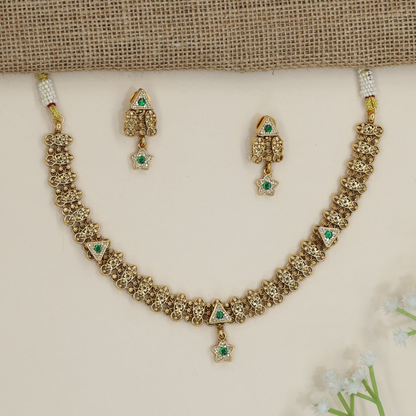 Artisan kundan necklace with repeating floral openwork pattern
