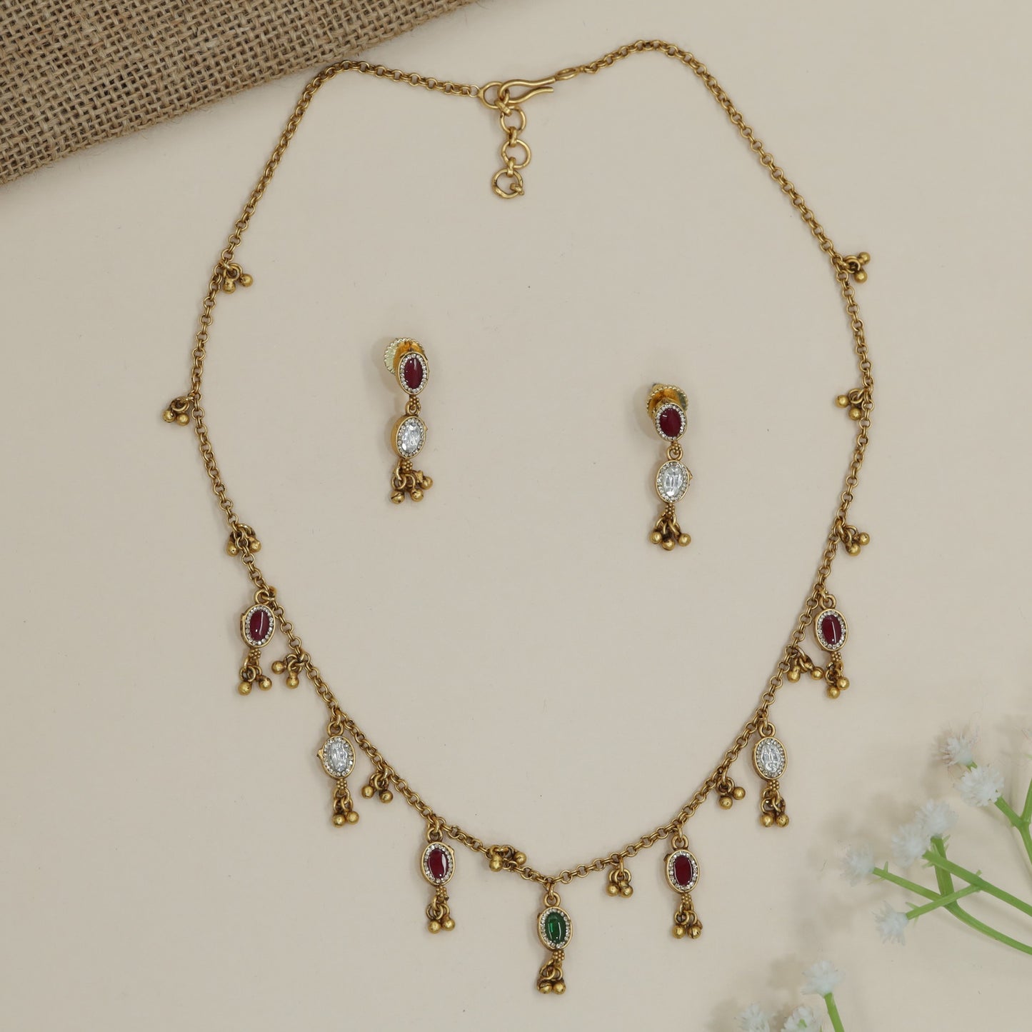 Lightweight charm necklace with ornamental pendant stations